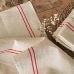 Torchon ancien en lin, 2 liteaux rouges de 1930